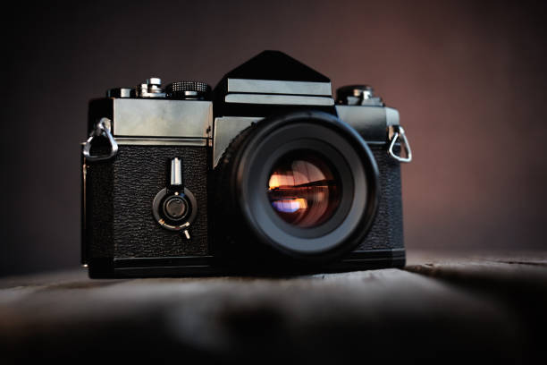Vintage film camera on wooden table