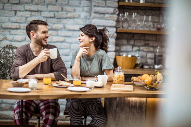 istock Happy couple talking during morning coffee at home. 1047505290