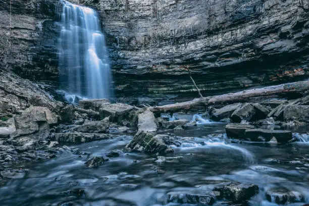 Photo of Beautiful Waterfall Rushing off stunning rock escarpment; Early Winter cool colors; Hamilton, Ontario, Canada