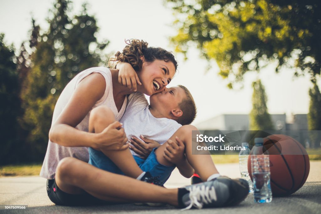 I love you mommy. I love you mommy. Mother and son on playground. Mother Stock Photo
