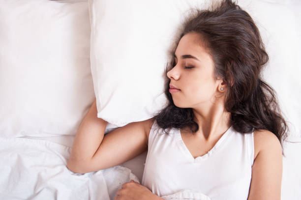 istock The girl is sleeping in bed 1047513644