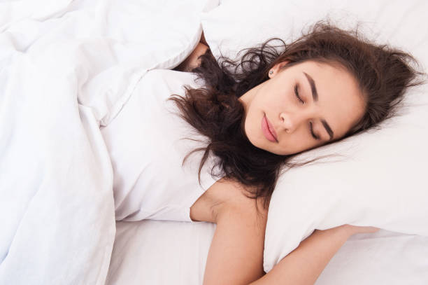istock The girl is sleeping in bed 1047513740