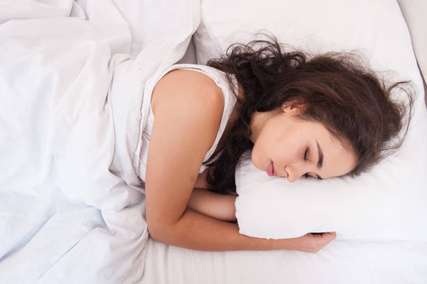 istock The girl is sleeping in bed 1047513756