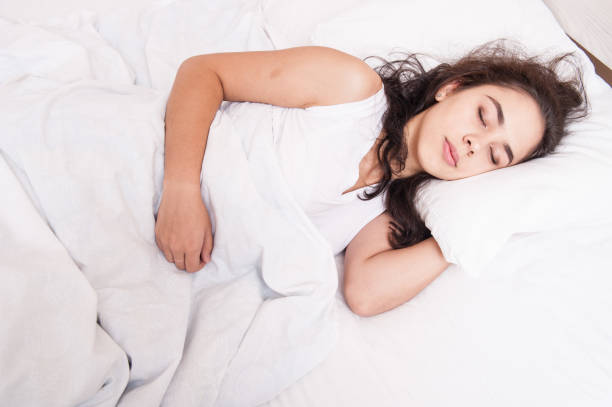 istock The girl is sleeping in bed 1047513786