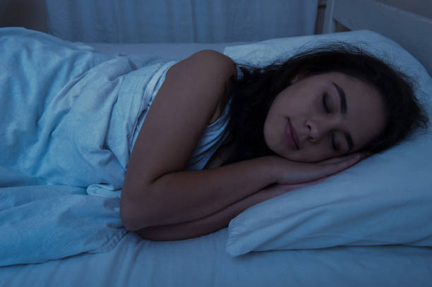 istock The girl is sleeping in bed. night lighting 1047513842
