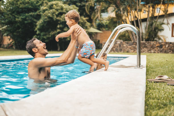 istock Family at the pool 1047518306