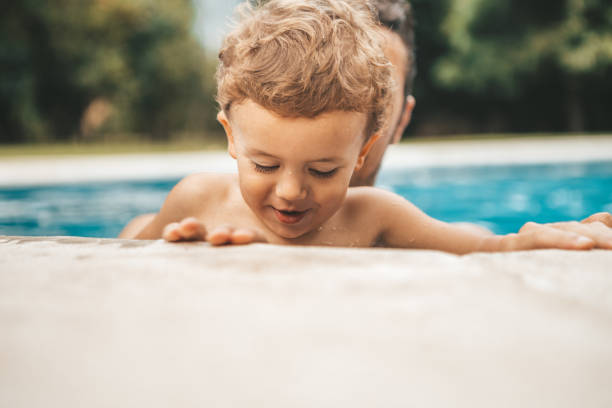istock Family at the pool 1047518398