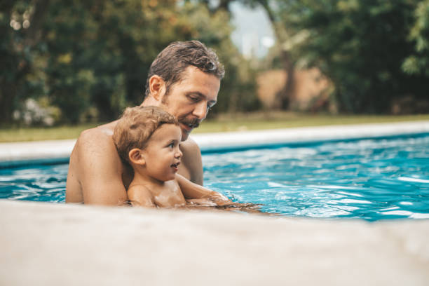 istock Family at the pool 1047518440