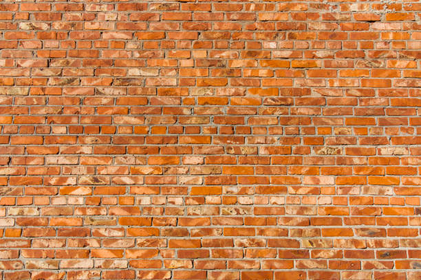 istock Background of old vintage red brick wall, texture. Abstract background, empty template. 1047520980