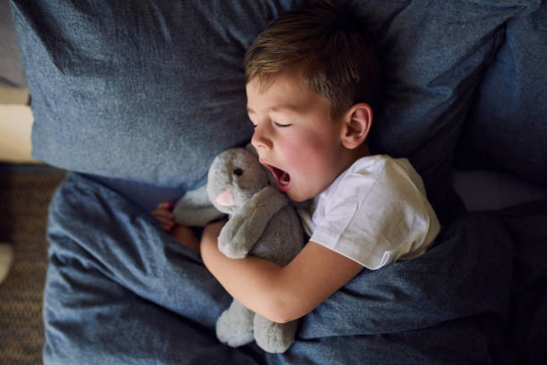 Nighty night, sleep tight High angle shot of an adorable little boy sleeping in bed at home bedtime stock pictures, royalty-free photos & images