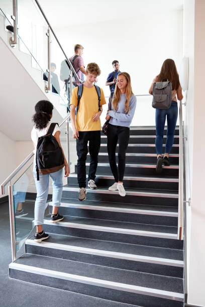 istock High School Students Walking On Stairs Between Lessons In Busy College Building 1047529520