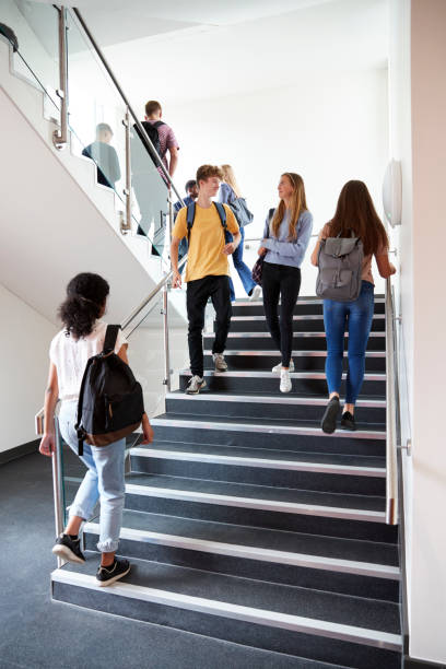 istock High School Students Walking On Stairs Between Lessons In Busy College Building 1047529564