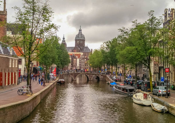 istock Amsterdam river bridge canal grachten, Holland Netherlands 1047530074