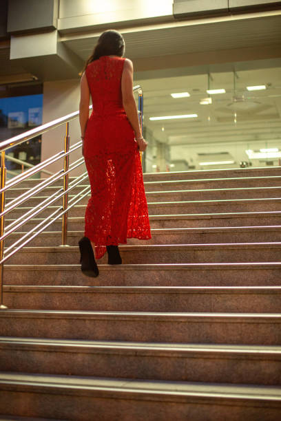 istock Gorgeous young girl walking up stairs. 1047532900