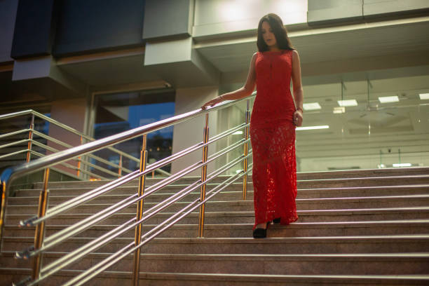 Gorgeous young girl walking down stairs.