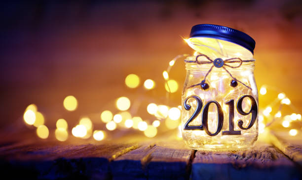 Open 2019 - Christmas Lights In The Jar - Blurred Background 2019 - Christmas String In The Jar With Bokeh new year's eve 2019 stock pictures, royalty-free photos & images