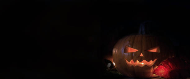 istock Halloween dark black background. Spooky pumpkin fantasy scary texture 1047539934