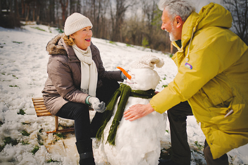 Senior couple enjoy winter time at nature
