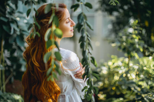 istock Dreamy woman in tropical environment 1047550938