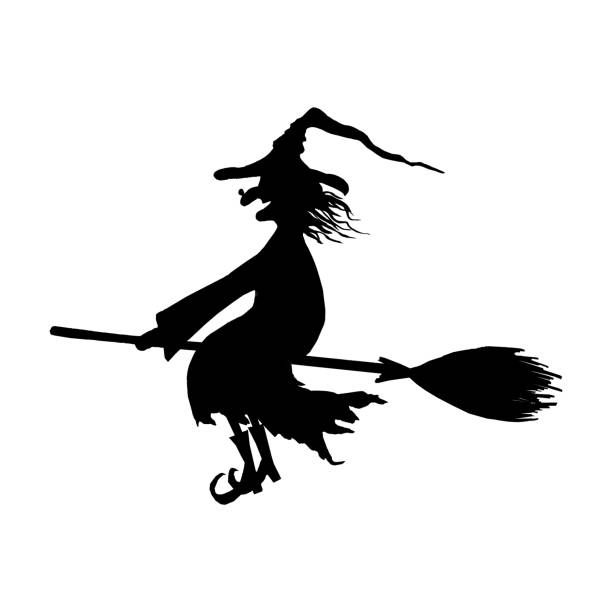 istock Silhouette of halloween smiling wicked witch on broomstick 1047557376