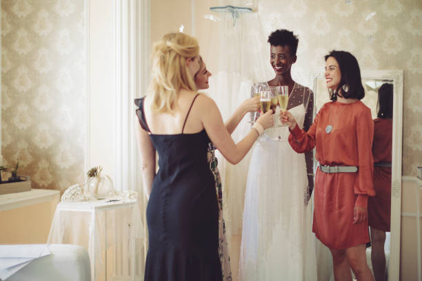 istock The bride is trying on her wedding dress 1047557896