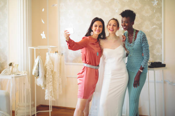 istock The bride is trying on her wedding dress 1047559682