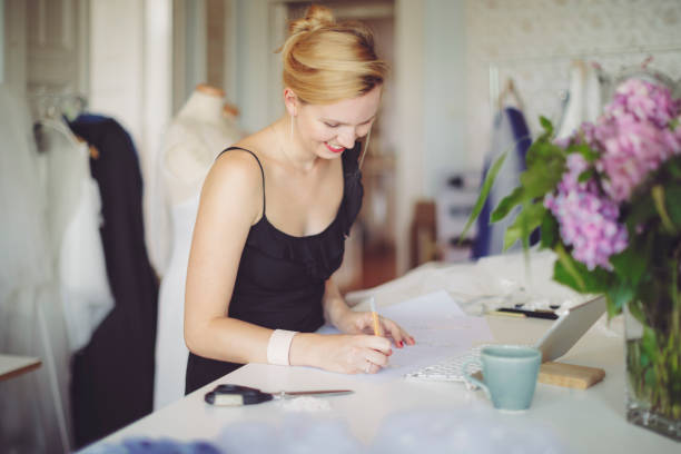 istock Fashion designer is making new sketches 1047561132