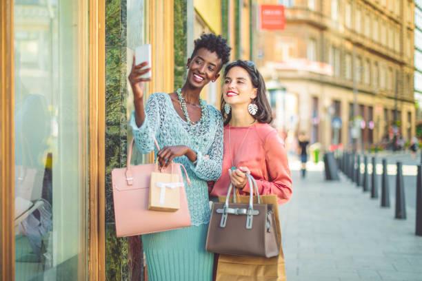 istock Friends are window shopping and taking selfies 1047561310