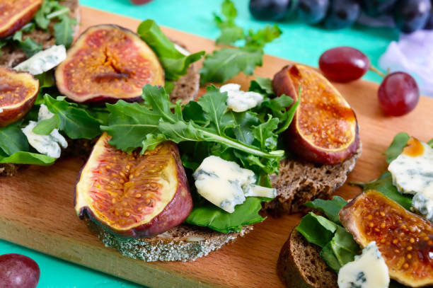 istock Useful sandwich with figs, blue cheese, arugula, balsamic on whole wheat bread. Healthy eating. 1047564730