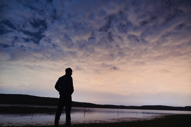 istock Adventurer man standing in nature 1047565928