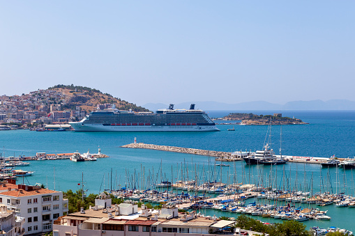 Kusadasi, Aydin, Turkey - August 13, 2011: Cruise ship at the Kusadasi Port. Kusadasi which is a resort town on Turkey's Aegean coast. Most of the people will visit the Ephesus ruins, Mary Home and Selcuk province during the day.