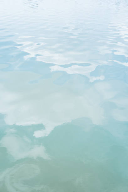 istock Lake with cloud reflected in the water 1047568694