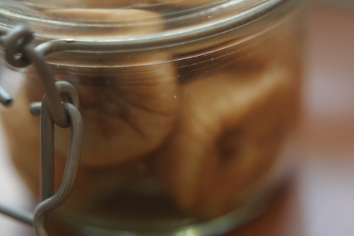 Close up of dry raw figs in a glass jar ready for winter