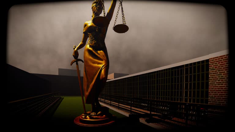 Lady justice standing at prison yard