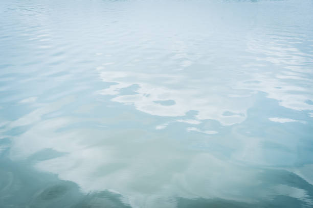 istock Lake with cloud reflected in the water 1047573428