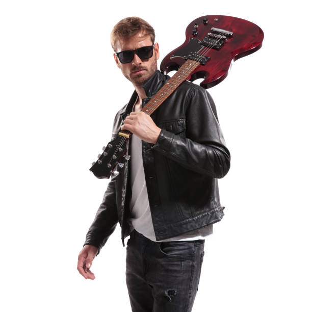 istock cool guitarist in black leather jacket posing with his guitar 1047574624