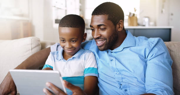 istock Watching a movie with my son 1047577880