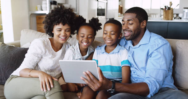 istock Watching a movie together as a family using a device 1047577926