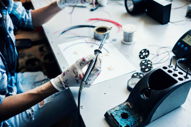 istock Woman soldering 1047581810