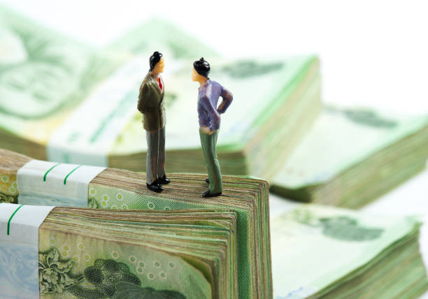 istock Miniature businessman on banknotes 1047589144