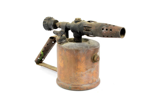 istock Vintage Brass Fire Blowtorch Flame Thrower On White Background 1047589856
