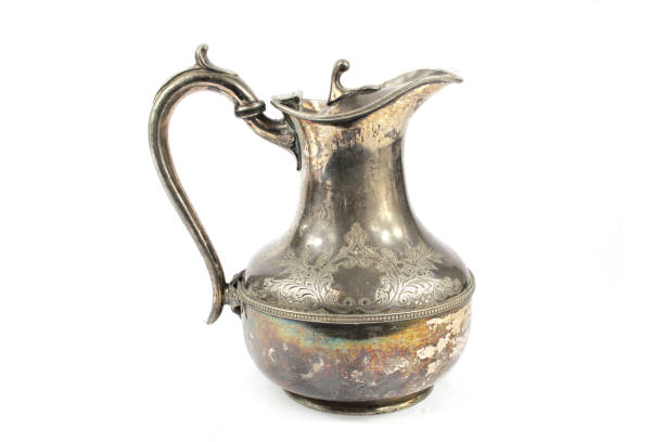 istock Quirky Vintage Antique Silver Kettle Teapot on White Background 1047589862