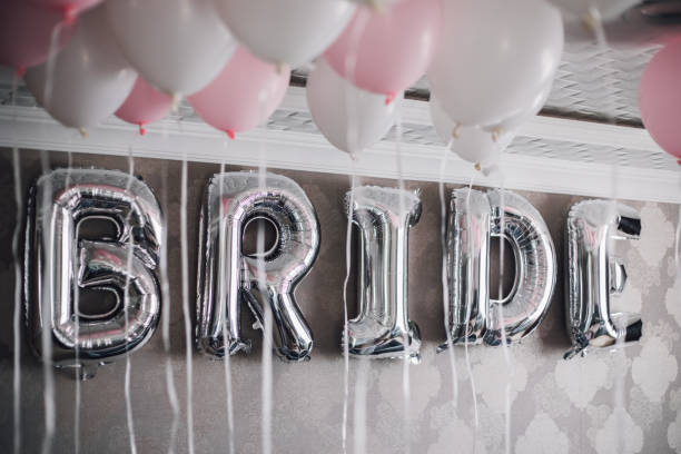 istock Bride letter balloons in hotel room 1047589948