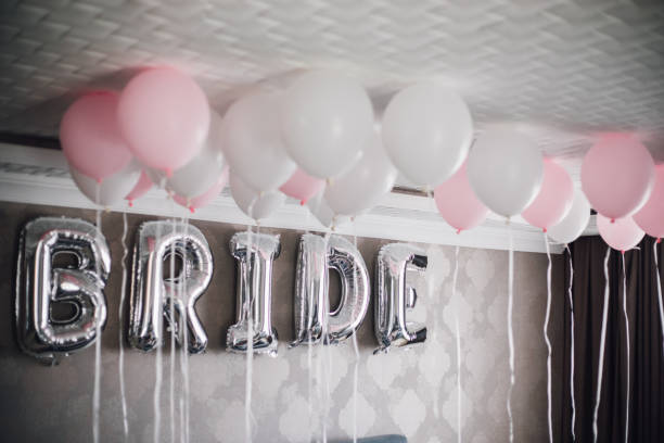 istock Bride letter balloons in hotel room 1047590458