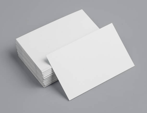 istock blank business cards on grey background,texte & logo 1047592732