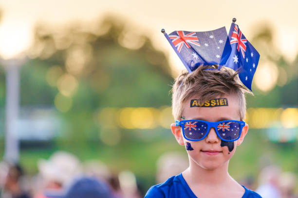 istock Cute Australian boy with flags and tattoos on his face 1047592734