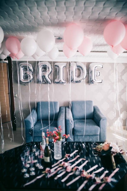 istock Bride letter balloons in hotel room 1047593138