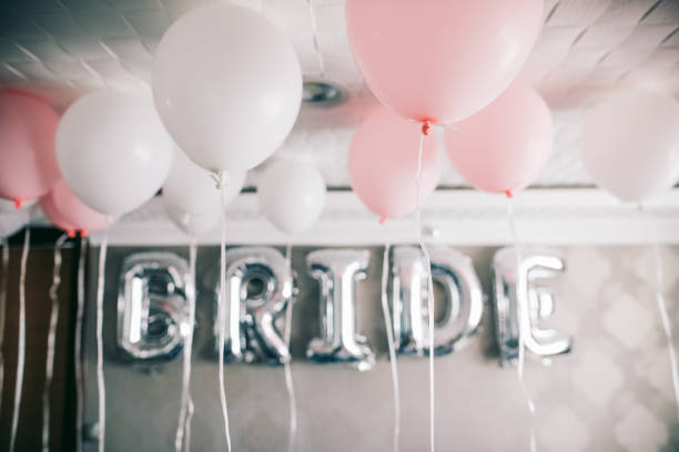 istock Bride letter balloons in hotel room 1047593308