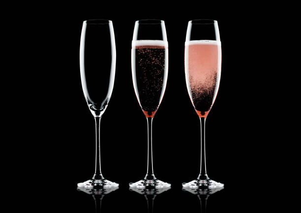 istock Rose pink champagne glasses with bubbles 1047595306
