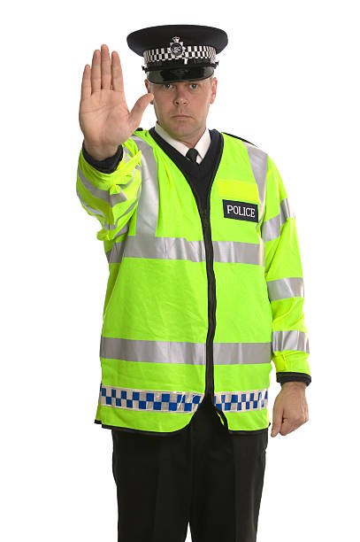 Policeman in reflective jacket ordering you to STOP.